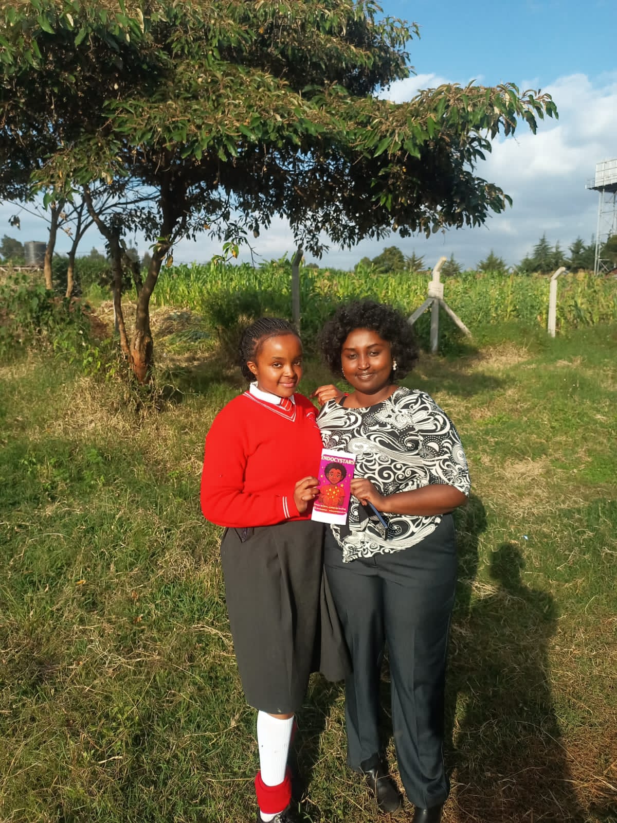 A speaker presenting to an audience in a school hall.